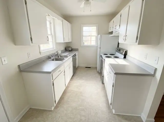 Small updated kitchen with new light grey laminate countertops